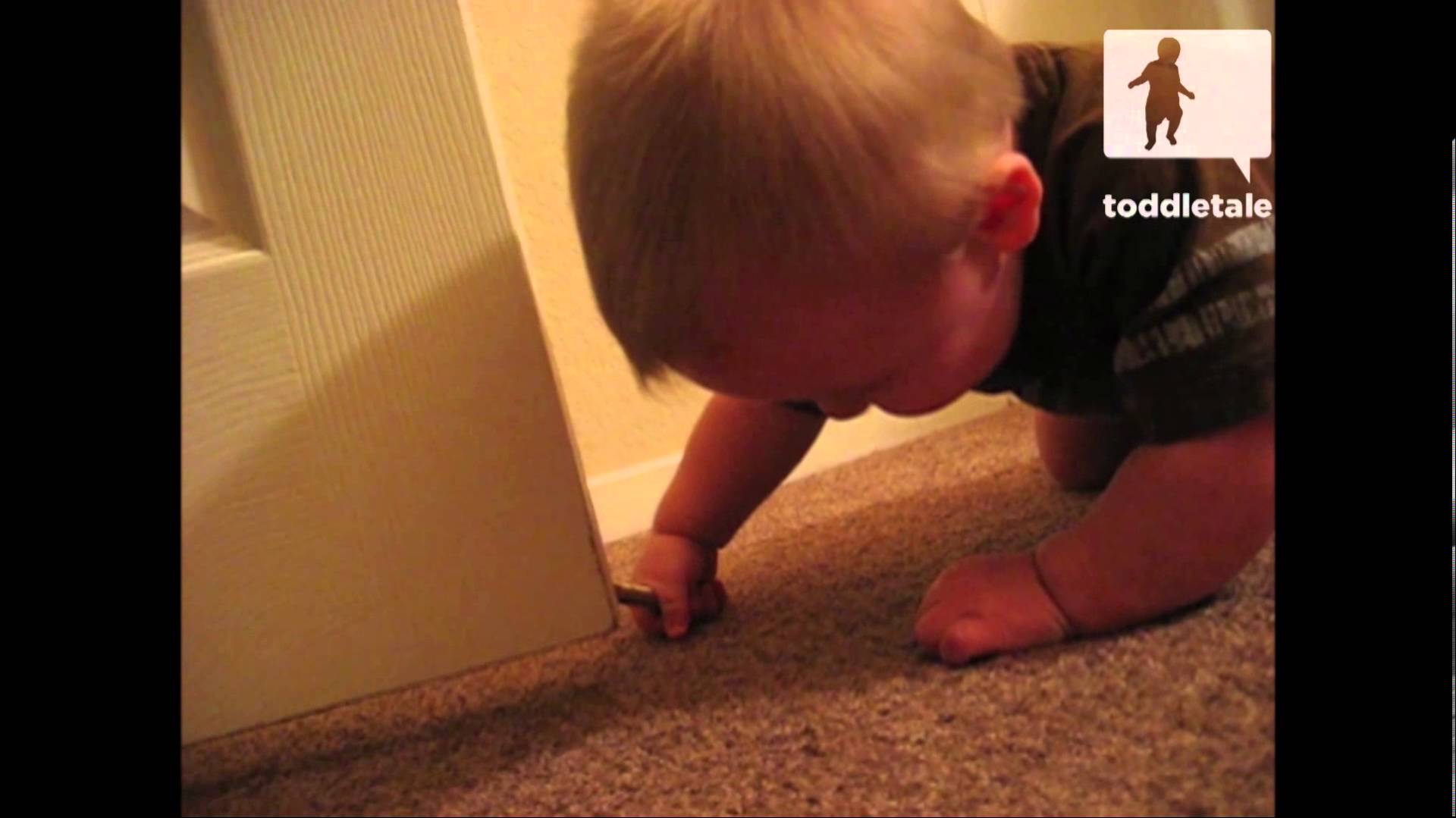 Baby thinks door stop is hilarious!