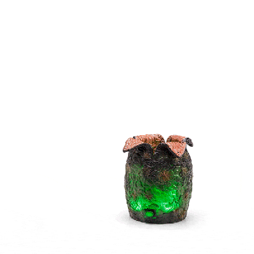 Green glowing alien egg with facehugger