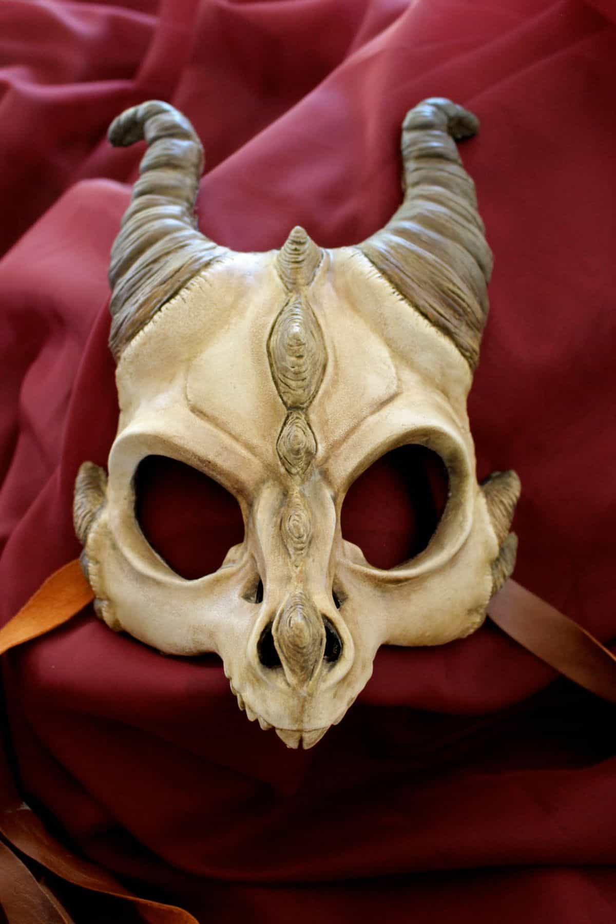 Handmade masks of dragons, owls and horned demons
