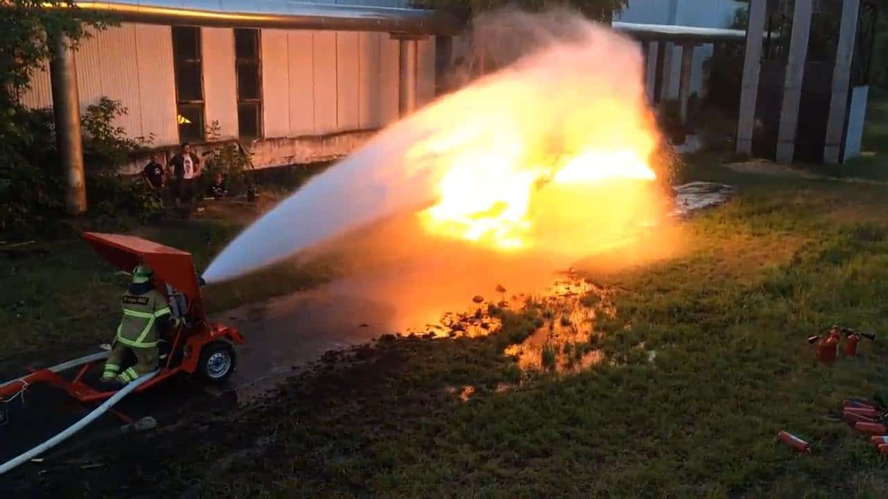 Flamethrower against water jet