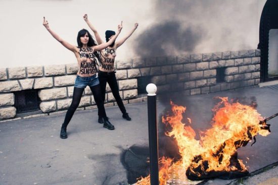 Topless lebanese girls burning ISIS flags…