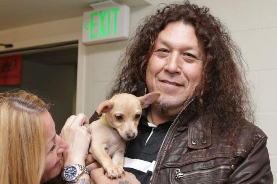 Slayer and Testament cuddle with puppies