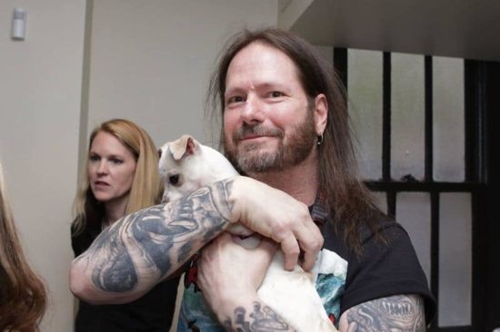 Slayer and Testament cuddle with puppies