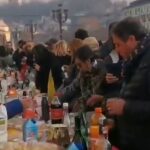 In Turin, many people eat outside at a richly set table, regardless of their vaccination status